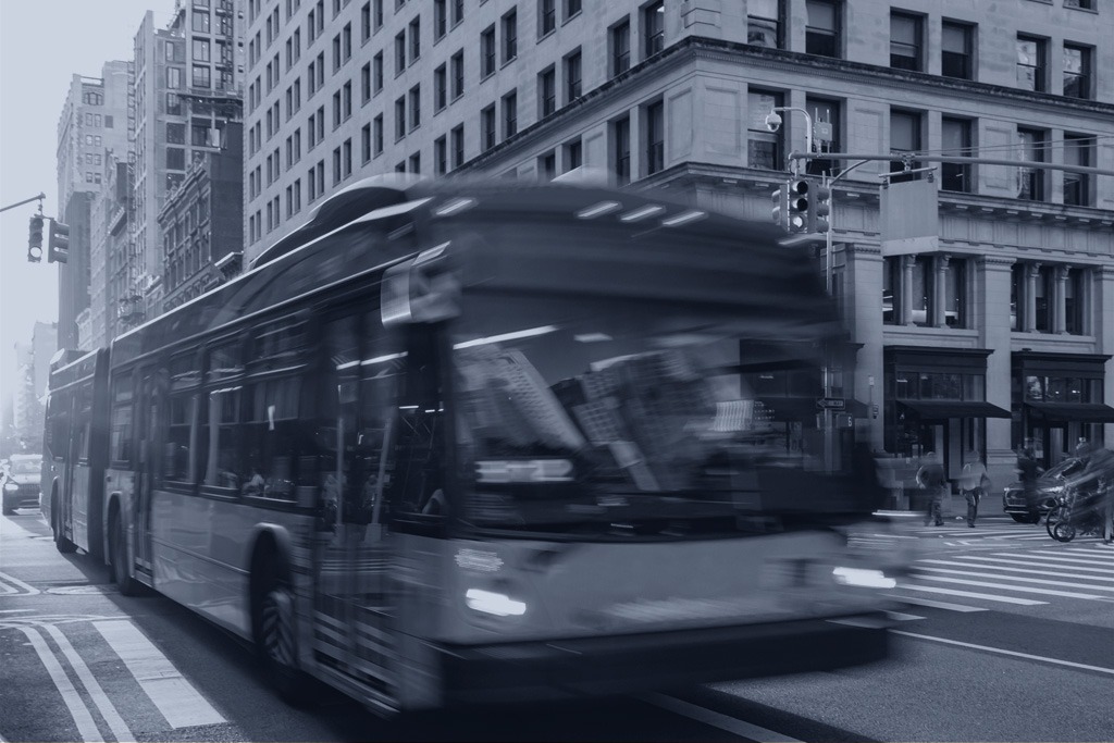 Bus driving along a NY street, New York bus accident lawyer page