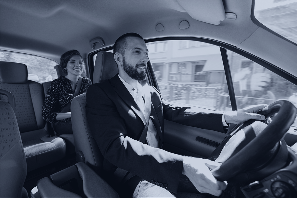 Driver speaking with a passenger for the “Can I sue Uber for an accident in New York
