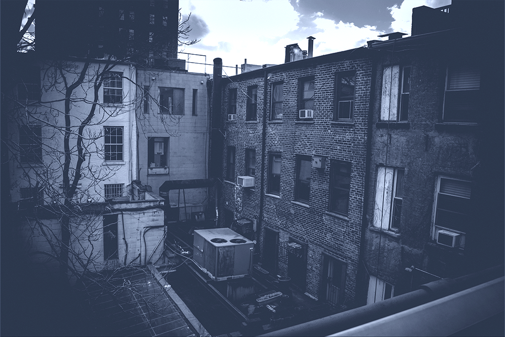 Rundown apartments in New York City [Can you lighten this ? Hard to see